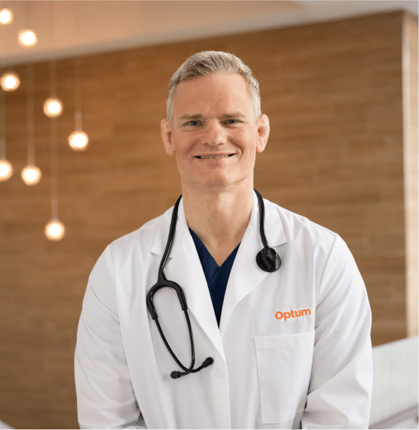 Optum WA doctor in a white coat with a stethoscope