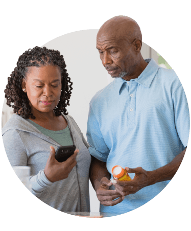Older couple reviewing medication instructions on a smartphone